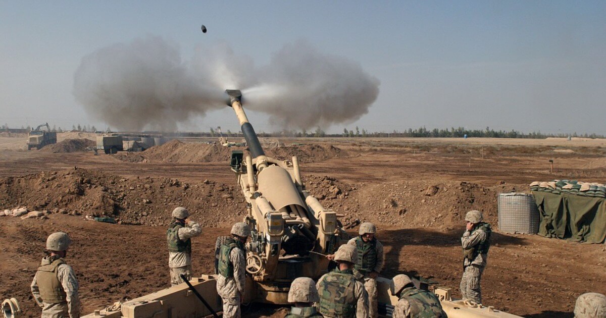 Artillery piece firing shells