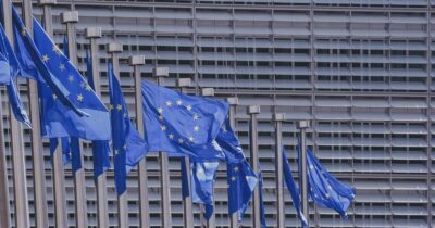 EU flags in front of EU building in Brussels