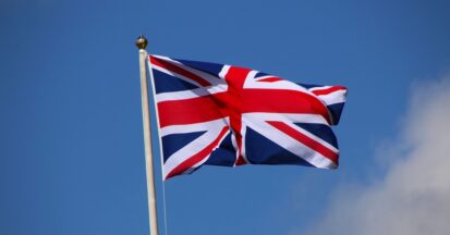 Flag of the United Kingdom against a blue sky