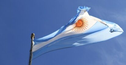 The flag of Argentina in the wind against a blue sky