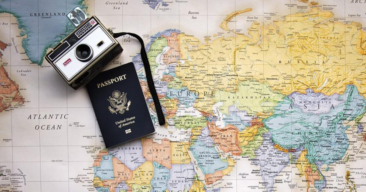 A passport on a map of the world