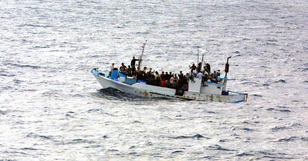 Refugees crossing the ocean on a small boat
