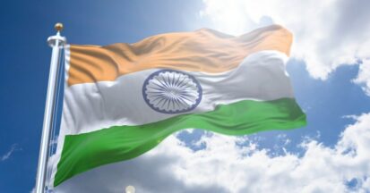 The flag of India against a blue sky
