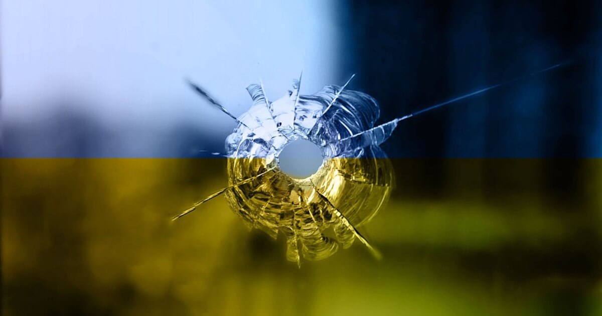 Glass in the color of the ukraine flag with a bullet hole
