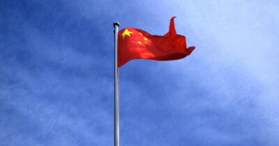 The flag of China against a blue sky