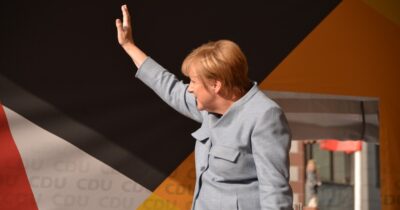 Angela Merkel leaving the stage waving